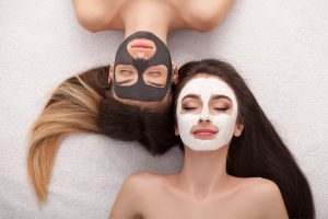 Two Teens receiving facial treatments for acne